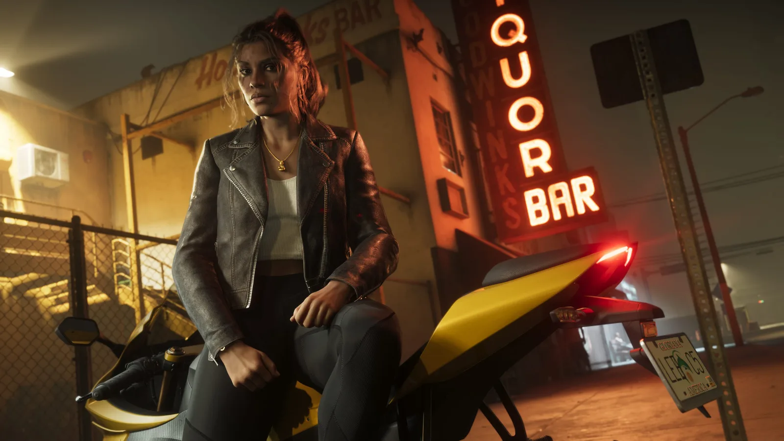 Lucia leaning on a motorcycle.